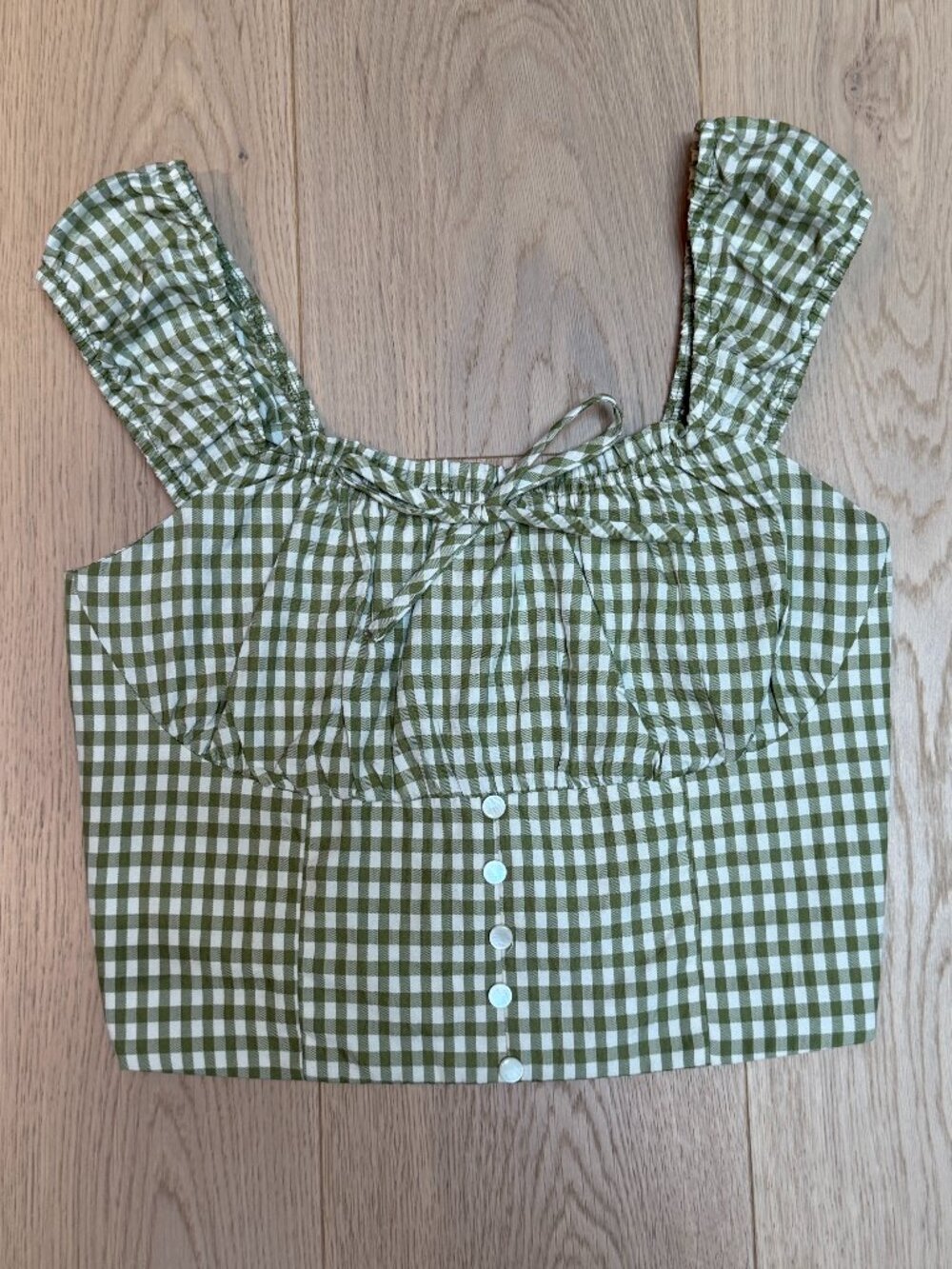 Green gingham tank top with bow and buttons and stretch/adjustable back